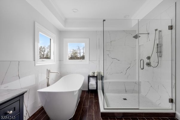 Bathroom, Free Standing Baths, Glass Shower, Interior, Marble Walls, Recessed Lighting, Wood Texture Flooring