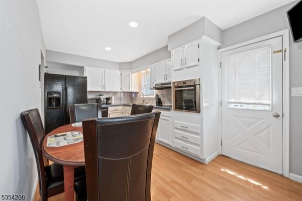 Dining room, Interior, Kitchen, Recessed Lighting, Stainless Steel Appliances, Wood Texture Flooring