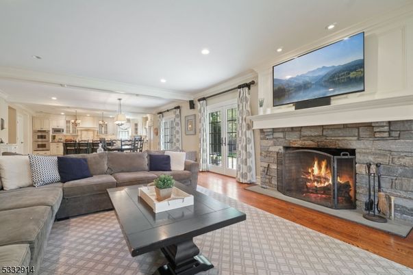 Fireplace, Interior, Kitchen, Living room, Pendant Lights, Recessed Lighting, Stainless Steel Appliances, Stone Walls, Wood Texture Flooring