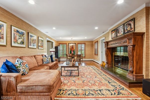 Chandelier, Dining room, Fireplace, Interior, Living room, Recessed Lighting, Wood Texture Flooring, Wooden Walls