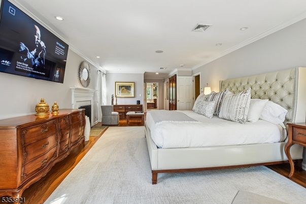 Bedroom, Fireplace, Interior, Recessed Lighting, Wood Texture Flooring