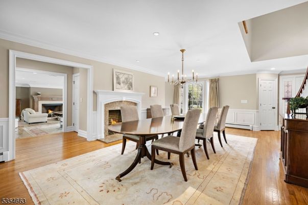 Chandelier, Dining room, Fireplace, Interior, Pendant Lights, Recessed Lighting, Wood Texture Flooring