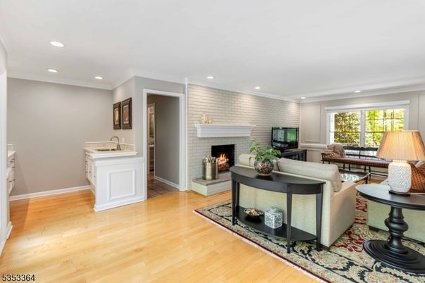 Fireplace, Interior, Living room, Recessed Lighting, Stone Walls, Wood Texture Flooring