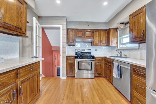 Interior, Kitchen, Recessed Lighting, Stainless Steel Appliances, Wood Texture Flooring