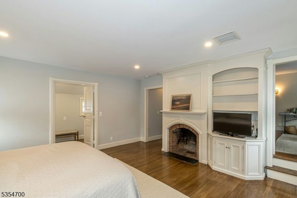 Bedroom, Fireplace, Interior, Recessed Lighting, Wood Texture Flooring