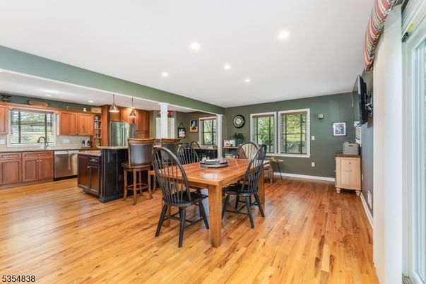 Dining room, Interior, Kitchen, Pendant Lights, Recessed Lighting, Stainless Steel Appliances, Wood Texture Flooring
