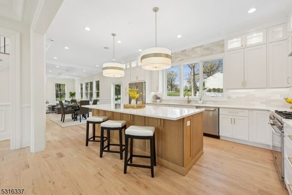 Dining room, Interior, Kitchen, Pendant Lights, Recessed Lighting, Stainless Steel Appliances, Wood Texture Flooring