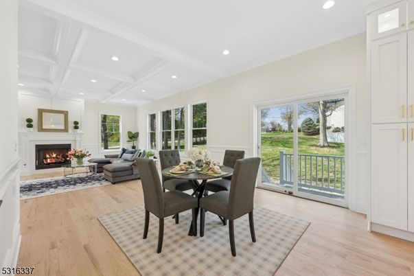 Dining room, Fireplace, Interior, Living room, Recessed Lighting, Wood Texture Flooring