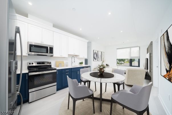 Dining room, Interior, Kitchen, Recessed Lighting, Stainless Steel Appliances, Wood Texture Flooring
