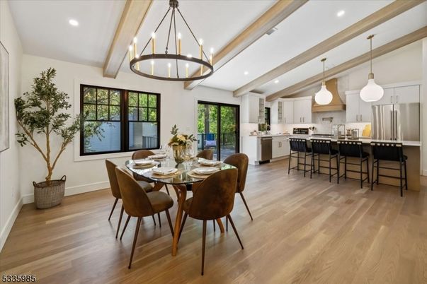 Chandelier, Dining room, Interior, Kitchen, Pendant Lights, Recessed Lighting, Stainless Steel Appliances, Wooden Beams, Wood Texture Flooring