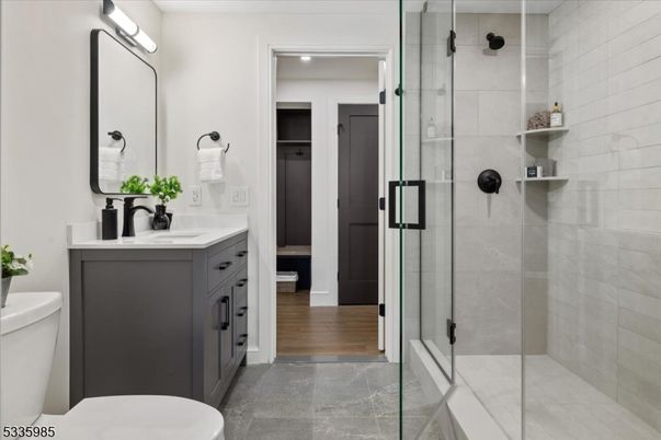 Bathroom, Dual Sink Vanities, Glass Shower, Interior, Wood Texture Flooring