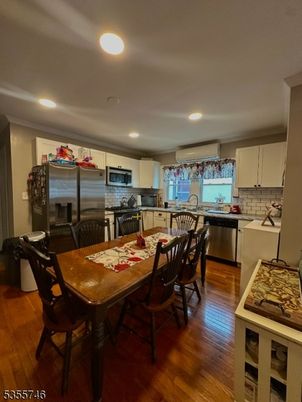 Dining room, Interior, Kitchen, Recessed Lighting, Stainless Steel Appliances, Wood Texture Flooring