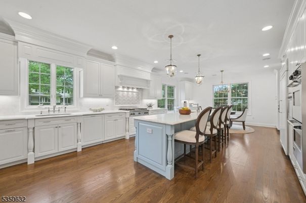 Chandelier, Dining room, Interior, Kitchen, Pendant Lights, Recessed Lighting, Stainless Steel Appliances, Wood Texture Flooring