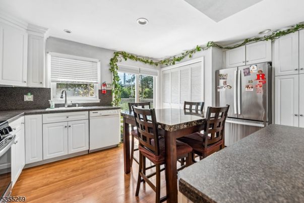 Dining room, Interior, Kitchen, Recessed Lighting, Stainless Steel Appliances, Wood Texture Flooring