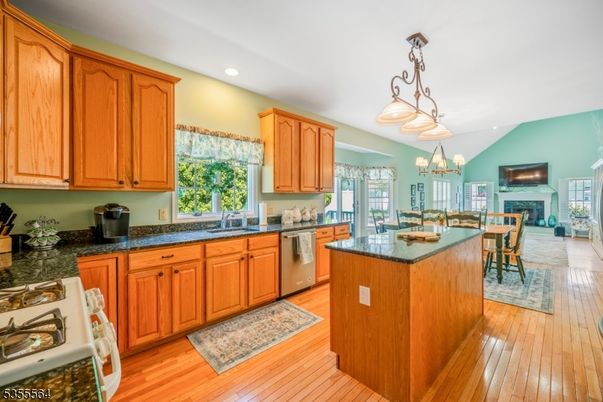 Chandelier, Dining room, Fireplace, Interior, Kitchen, Pendant Lights, Recessed Lighting, Wood Texture Flooring