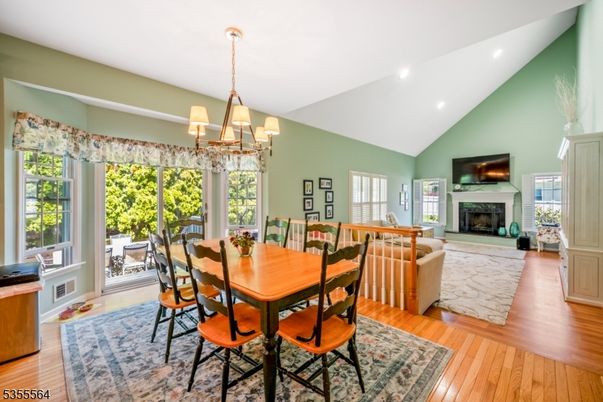Chandelier, Dining room, Fireplace, Interior, Living room, Recessed Lighting, Wood Texture Flooring