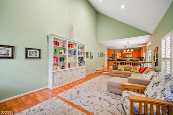 Chandelier, Dining room, Interior, Kitchen, Living room, Recessed Lighting, Wood Texture Flooring
