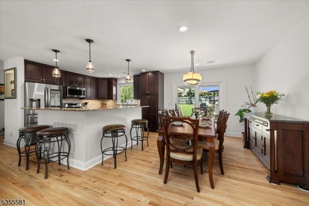 Dining room, Interior, Kitchen, Pendant Lights, Recessed Lighting, Stainless Steel Appliances, Wood Texture Flooring