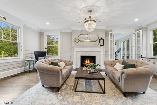 Chandelier, Fireplace, Interior, Living room, Recessed Lighting, Wood Texture Flooring