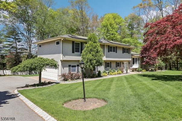 Attached, Backyard, Exterior, Facade, Solar Panels, Raised Ranch