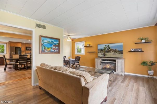 Dining room, Fireplace, Interior, Kitchen, Living room, Recessed Lighting, Wood Texture Flooring