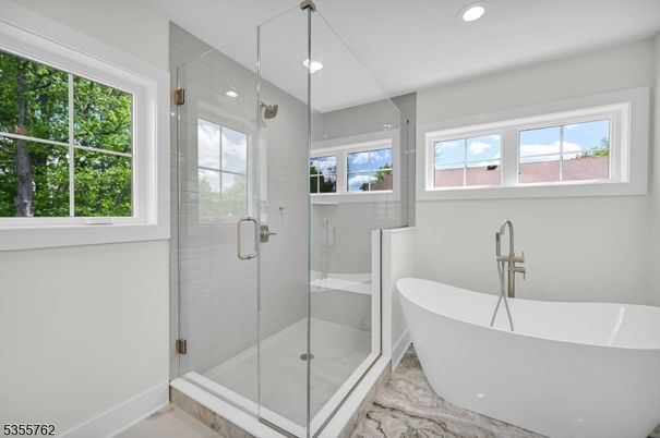 Bathroom, Free Standing Baths, Glass Shower, Interior, Marble Walls, Pendant Lights, Recessed Lighting