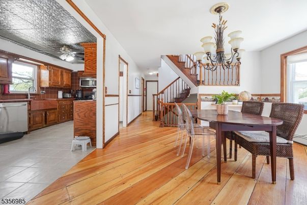 Chandelier, Dining room, Interior, Kitchen, Stainless Steel Appliances, Wood Texture Flooring