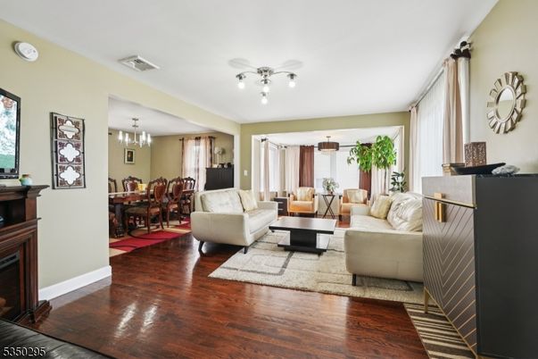 Chandelier, Dining room, Fireplace, Interior, Living room, Pendant Lights, Wood Texture Flooring