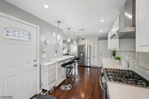 Interior, Kitchen, Pendant Lights, Recessed Lighting, Stainless Steel Appliances, Stone Walls, Wood Texture Flooring