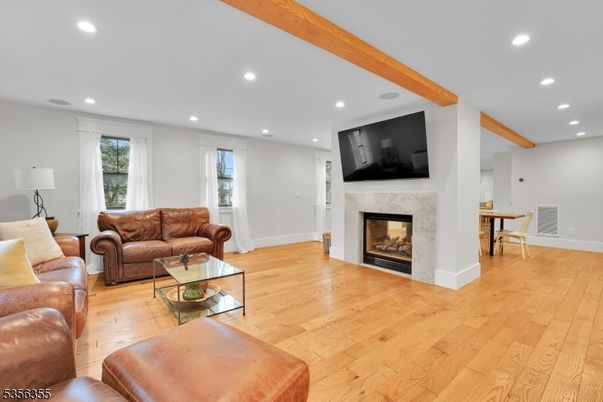 Dining room, Fireplace, Interior, Living room, Recessed Lighting, Wooden Beams, Wood Texture Flooring