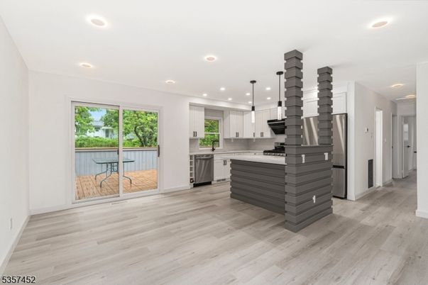 Interior, Kitchen, Pendant Lights, Recessed Lighting, Stainless Steel Appliances, Wood Texture Flooring