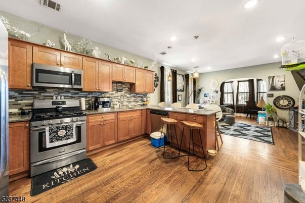 Interior, Kitchen, Pendant Lights, Recessed Lighting, Stainless Steel Appliances, Wood Texture Flooring