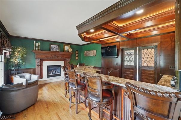 Fireplace, Interior, Recessed Lighting, Wood Texture Flooring, Wooden Walls