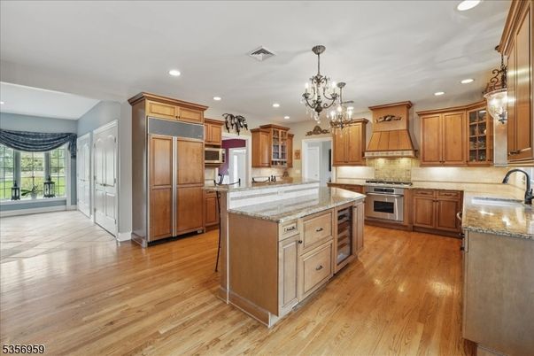 Chandelier, Interior, Kitchen, Pendant Lights, Recessed Lighting, Stainless Steel Appliances, Wood Texture Flooring
