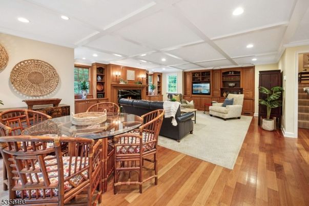 Dining room, Fireplace, Interior, Living room, Recessed Lighting, Wood Texture Flooring