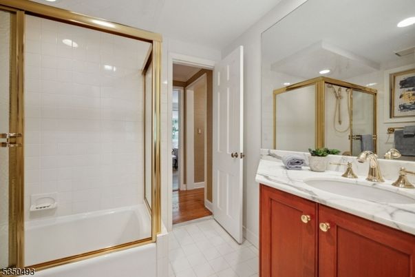 Bathroom, Dual Sink Vanities, Glass Shower, Interior, Recessed Lighting, Wood Texture Flooring