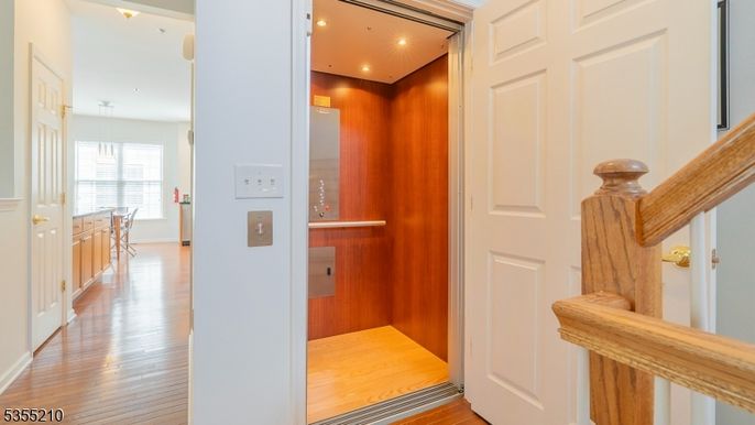 Elevator, Interior, Recessed Lighting, Wood Texture Flooring, Wooden Walls