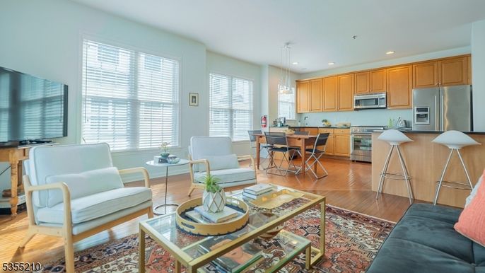 Dining room, Interior, Kitchen, Living room, Pendant Lights, Recessed Lighting, Stainless Steel Appliances, Wood Texture Flooring