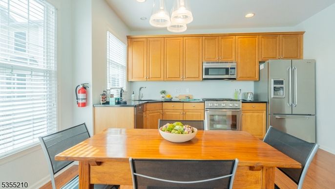 Dining room, Interior, Kitchen, Pendant Lights, Recessed Lighting, Stainless Steel Appliances, Wood Texture Flooring
