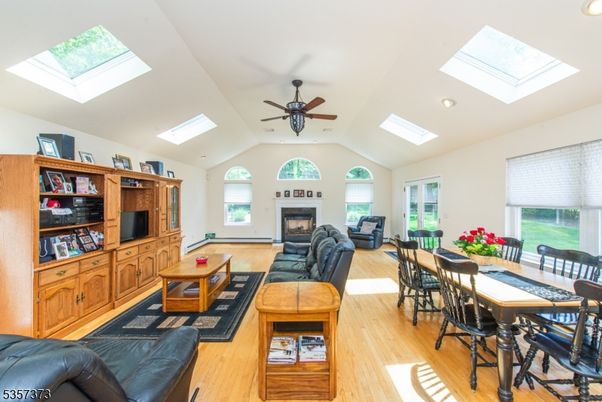 Dining room, Fireplace, Interior, Living room, Recessed Lighting, Wood Texture Flooring