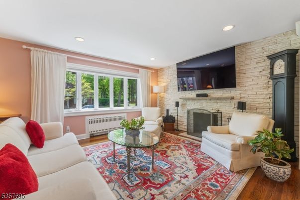 Fireplace, Interior, Living room, Recessed Lighting, Stone Walls, Wood Texture Flooring