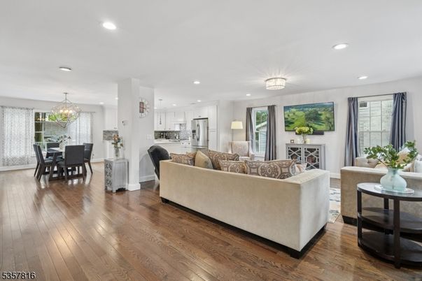 Chandelier, Dining room, Interior, Kitchen, Living room, Recessed Lighting, Stainless Steel Appliances, Wood Texture Flooring