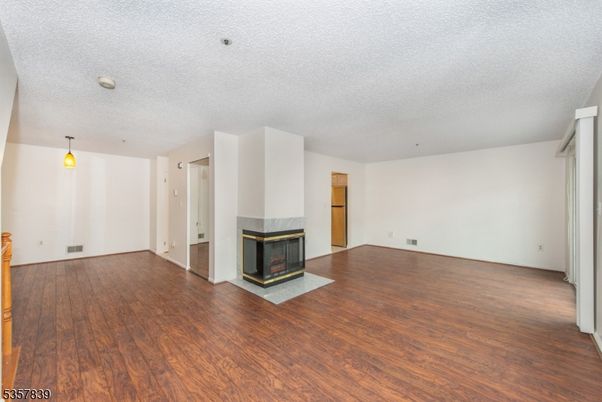 Empty room, Fireplace, Interior, Pendant Lights, Wood Texture Flooring