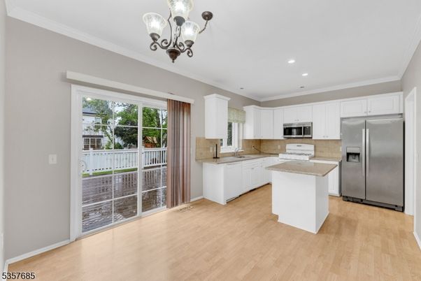 Chandelier, Interior, Kitchen, Recessed Lighting, Stainless Steel Appliances, Wood Texture Flooring