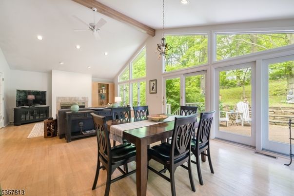 Dining room, Fireplace, Interior, Pendant Lights, Recessed Lighting, Wooden Beams, Wood Texture Flooring