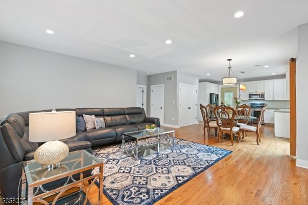 Dining room, Interior, Kitchen, Living room, Pendant Lights, Recessed Lighting, Stainless Steel Appliances, Wood Texture Flooring