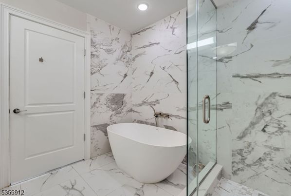 Bathroom, Free Standing Baths, Glass Shower, Interior, Marble, Marble Walls, Recessed Lighting