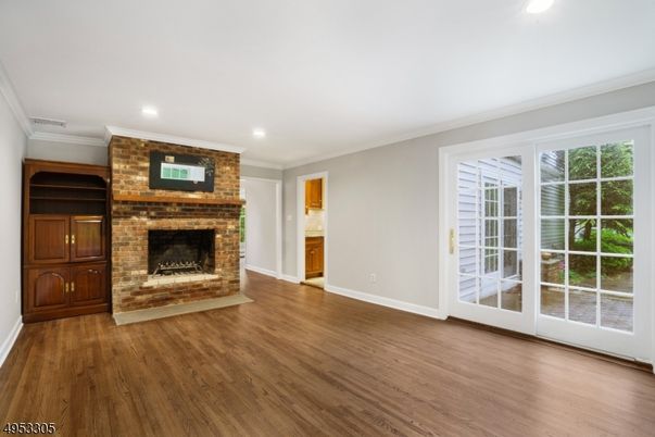 Empty room, Fireplace, Interior, Recessed Lighting, Stone Walls, Wood Texture Flooring