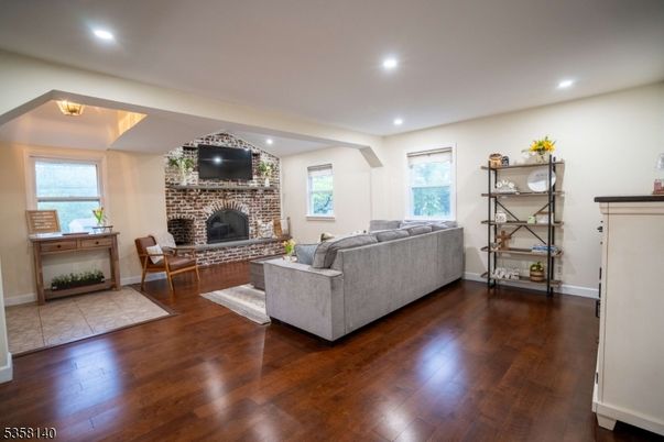 Fireplace, Interior, Living room, Recessed Lighting, Stone Walls, Wood Texture Flooring