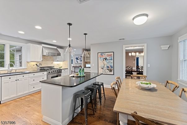 Dining room, Interior, Kitchen, Pendant Lights, Recessed Lighting, Stainless Steel Appliances, Wood Texture Flooring